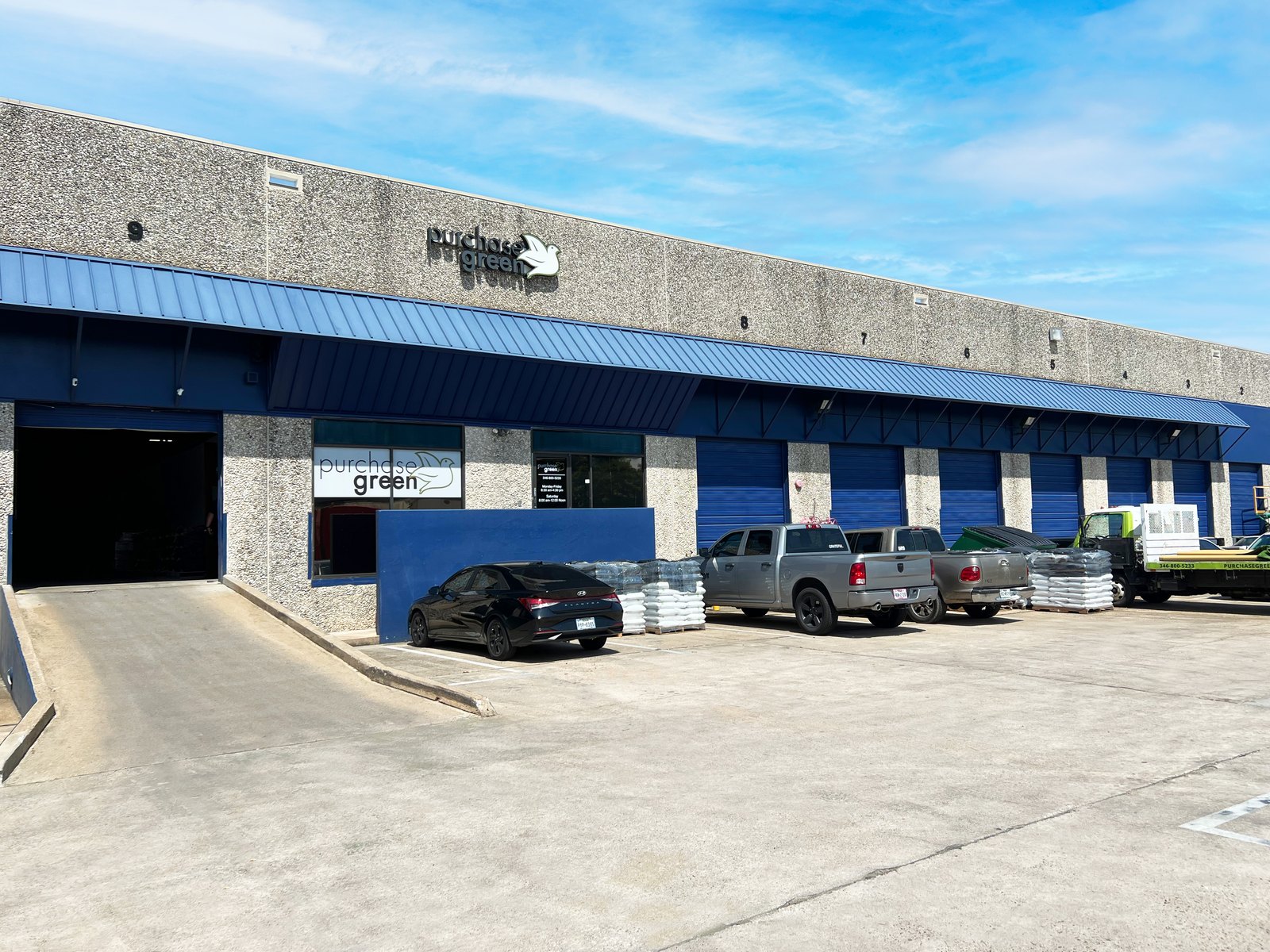 Warehouse exterior — dock doors, ramps and truck court, Long Point Business Center Ste 101