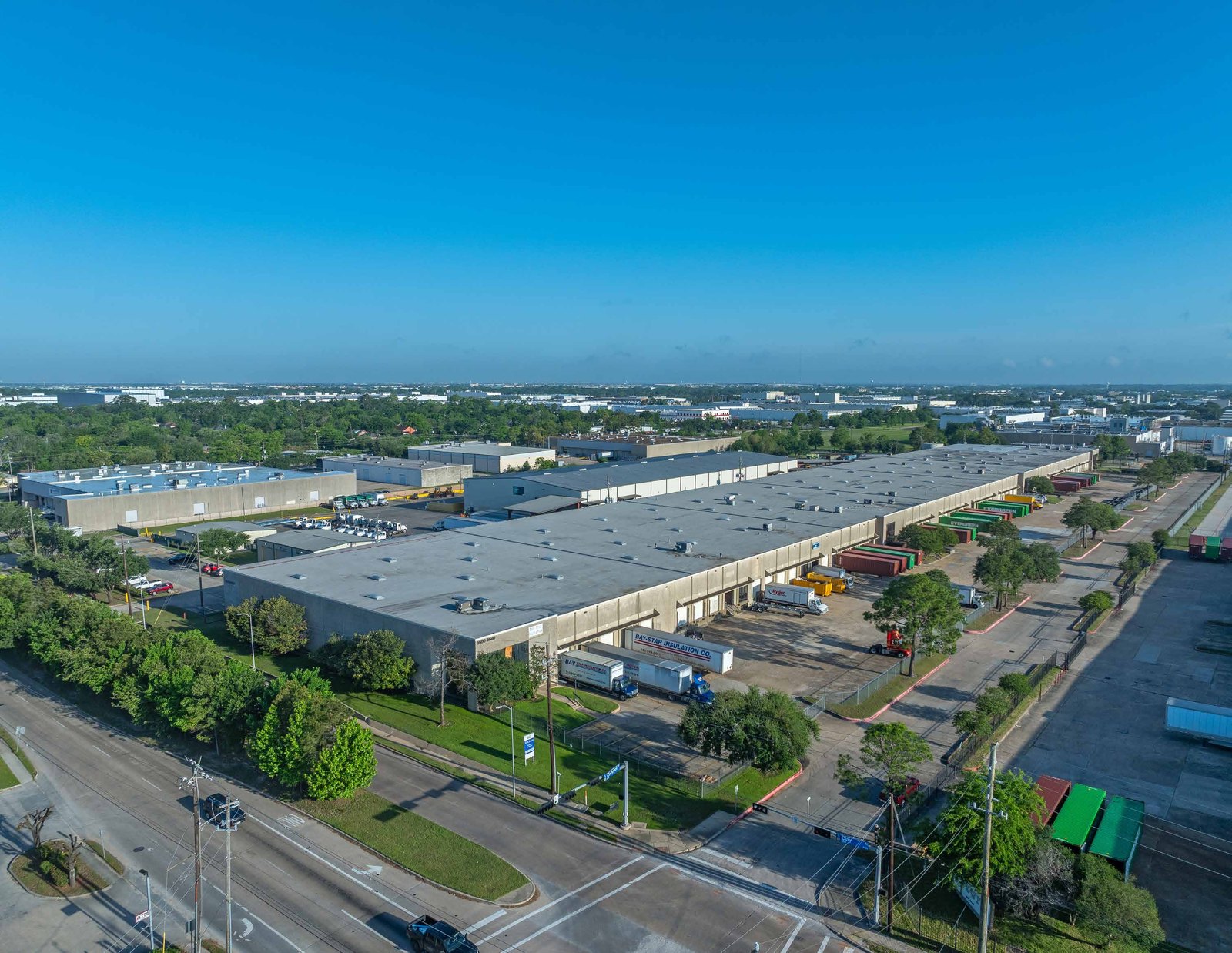 Aerial — Clay Campbell Business Park warehouse complex with truck courts and trailers, 9500-9540 Clay Rd