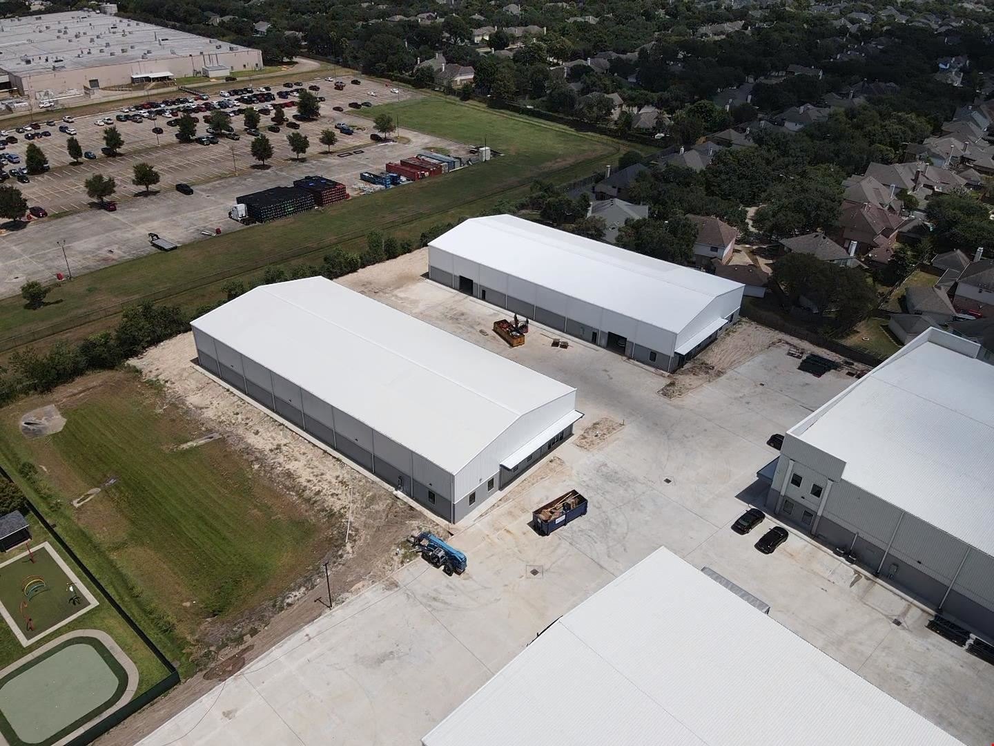 Aerial — industrial park with white warehouse buildings, North Eldridge Industrial Park